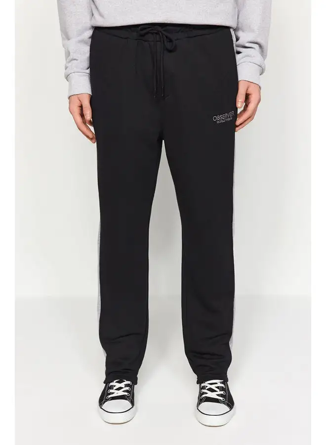 trendyol Black Men's Regular/Regular Cut Contrast Color Paneled Bold Text with Embroidered Regular Leg Sweatpants.