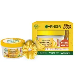 Garnier Ultra Doux غذاء الشعر المغذي بالموز 3 في 1 للشعر الجاف - 390 مل + شعر مستعار أصفر مجانًا