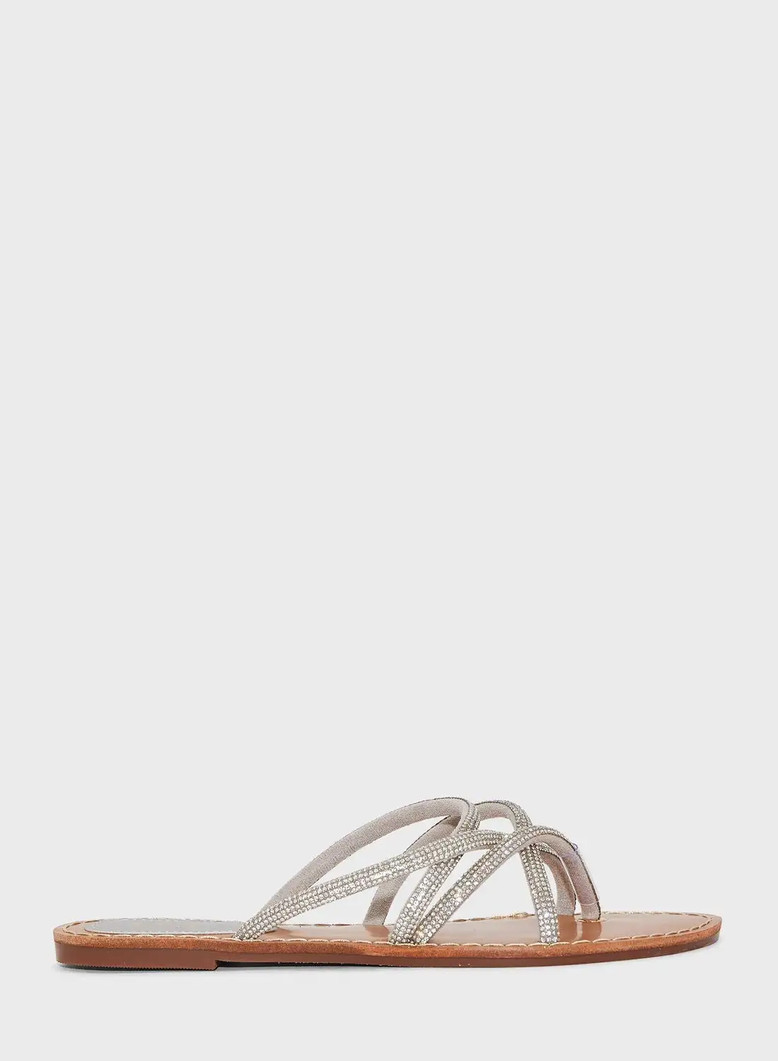 صندل مسطح بحزام ملتوي من Ella إصدار محدود من Diamante باللون الفضي