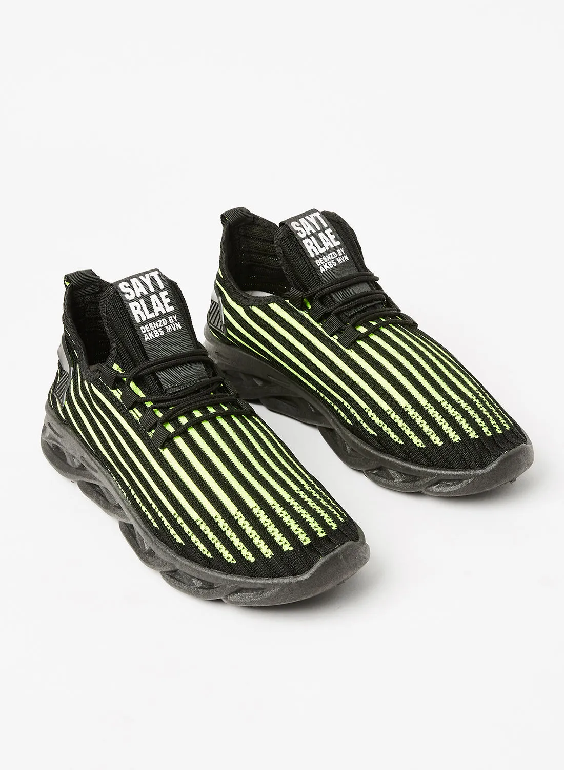 حذاء رياضي Revs مخطط برقبة منخفضة للرجال أسود / أخضر